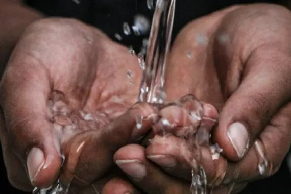 Hands holding water